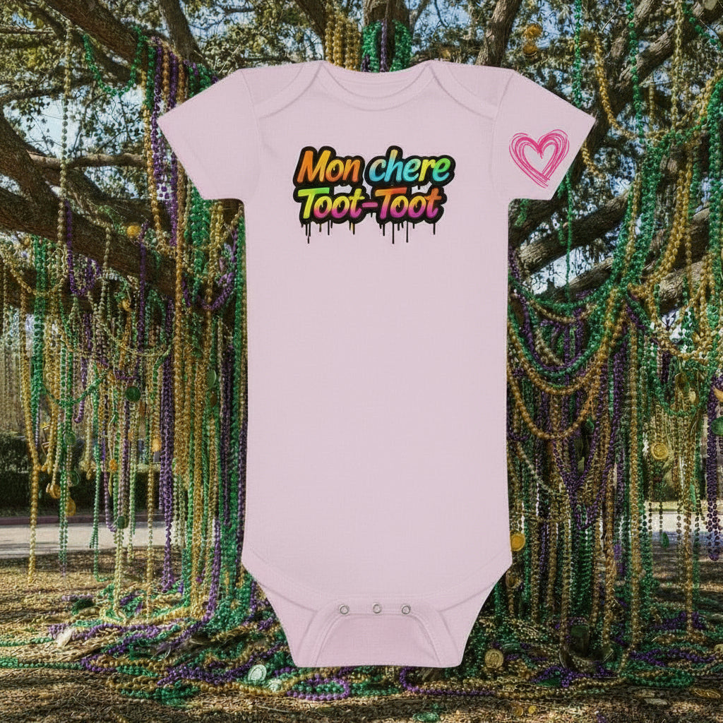 Pink baby onesie with red text on a white background